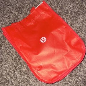 Lululemon shopping bag, red, and white